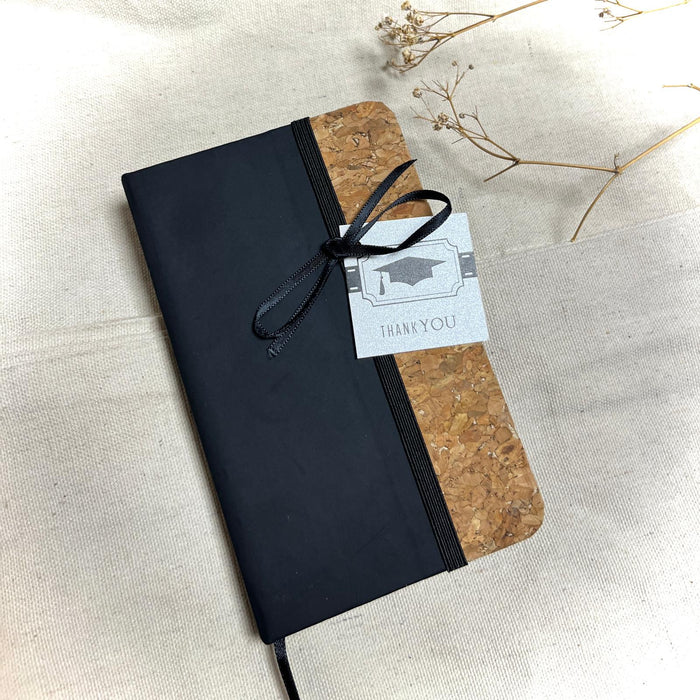 Notebook with a Graduation Tag