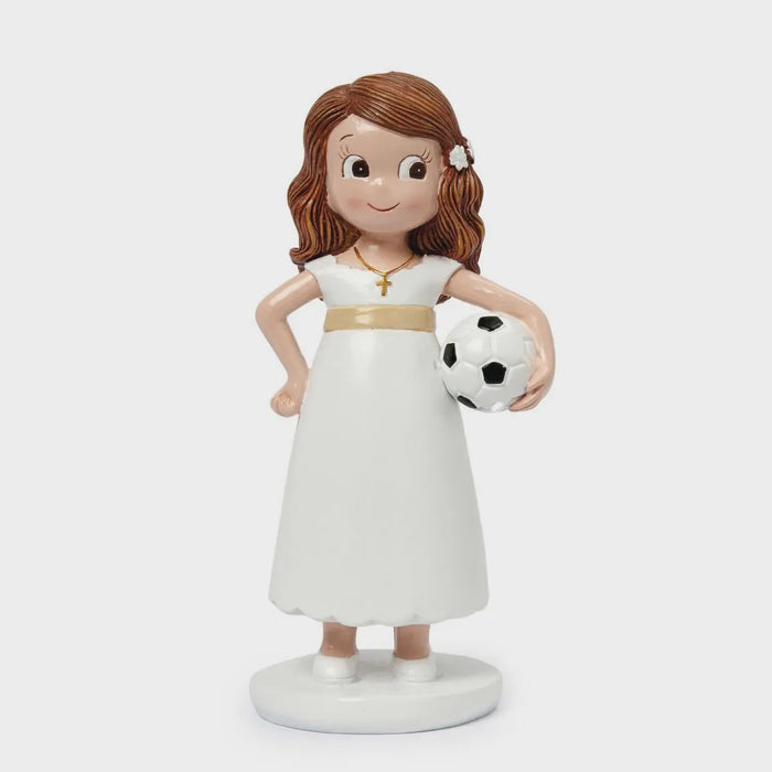 Communion girl with football figurine